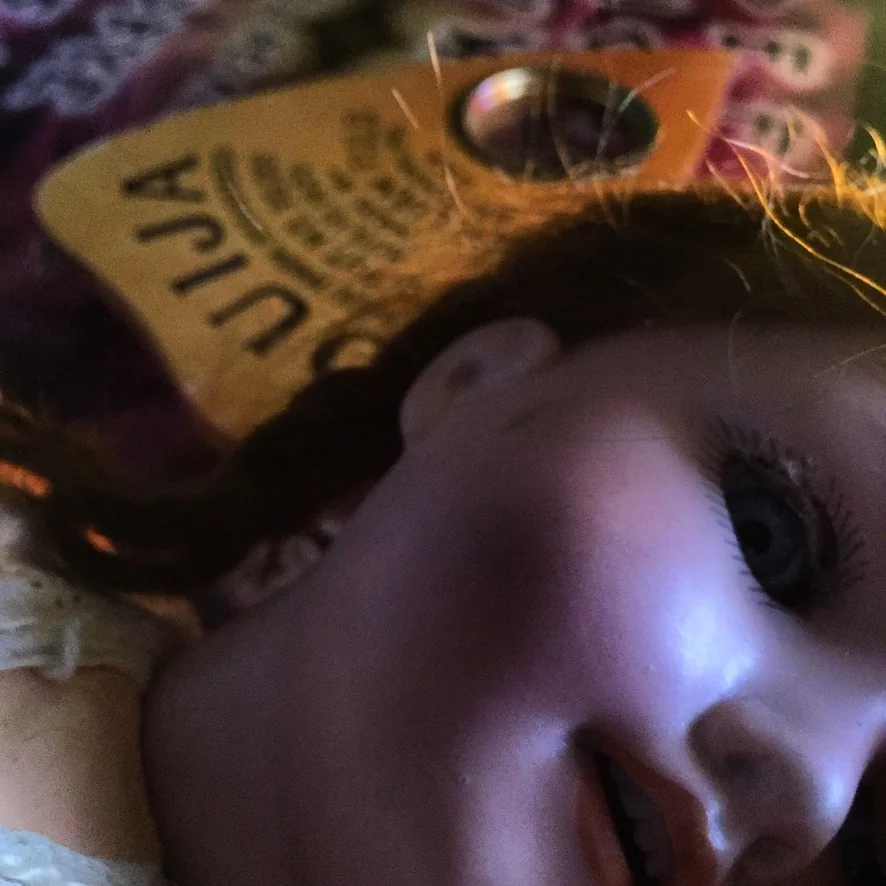 Close-up of a ZoZo Ouija board used as an illustration of LiveSciFi spirit-board research