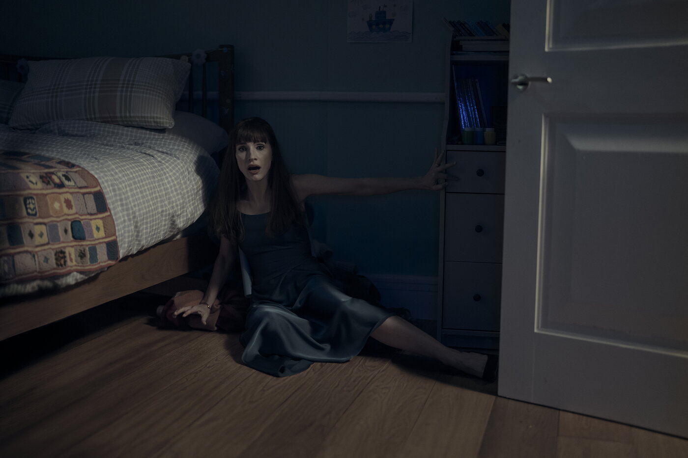 Jessica Chastain as Ursula in a dark bedroom scene from Other Mommy (2026)
