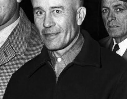 Archival black-and-white portrait of Ed Gein circa 1958 in police custody