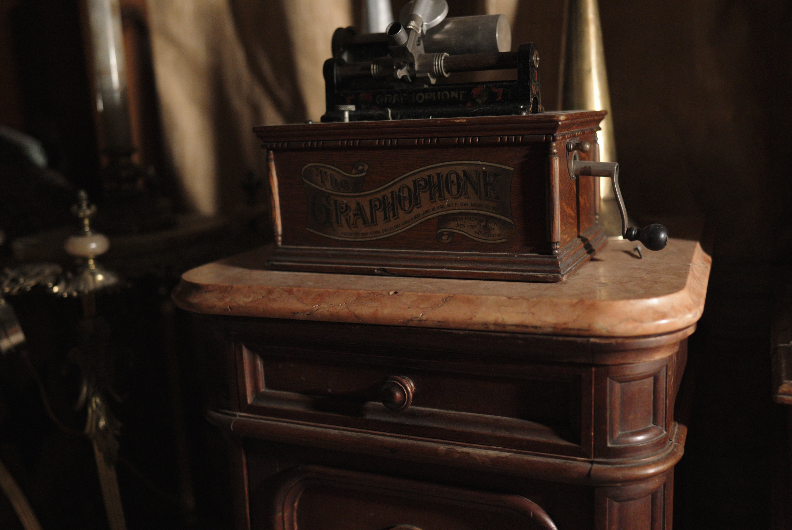 Vintage wood cabinet and Graphophone displayed in Mackay Mansion