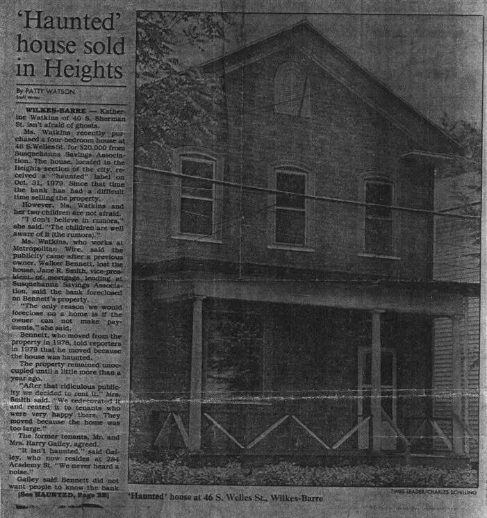 Historical Times Leader newspaper clipping titled 'Haunted house sold in Heights,' showing 46 South Welles Street in Wilkes-Barre
